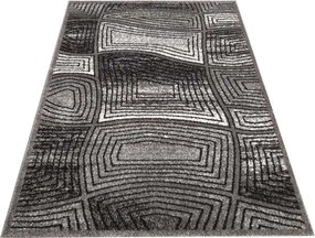 Moderný sivý koberec s abstraktným motívom