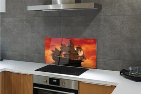 Sklenený obklad do kuchyne Loď mora oranžová obloha 140x70 cm