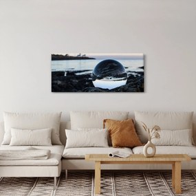 Obraz sklenené gule na skale (120x50 cm)