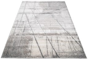 Béžovo-sivý dizajnový koberec s abstraktným vzorom
