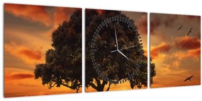 Obraz stromu pri západe slnka (s hodinami) (90x30 cm)