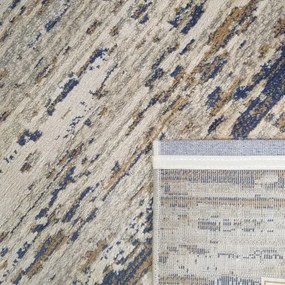 Moderný koberec v béžovo-hnedej farbe s modrým detailom