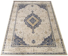 Nádherný vintage koberec v béžovej farbe s modrým vzorom