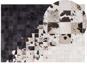 Kožený koberec 140 x 200 cm čierna/biela KEMAH Beliani