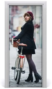 Fototapeta samolepiace dvere žena na bicykli 75x205 cm