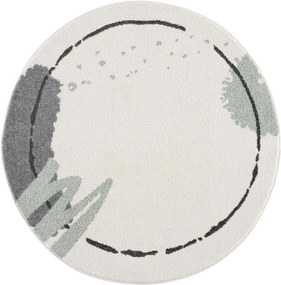 Krémový detský okrúhly koberec so zelenou machuľou