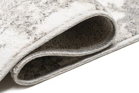 Dizajnový koberec s abstraktným vzorom v krémovej farbe Šírka: 80 cm | Dĺžka: 150 cm