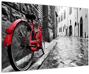Obraz červeného kolesa na dláždenej ulici (90x60 cm)