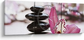 Obraz masážnych kameňov a orchidey na vode (s hodinami) (90x30 cm)