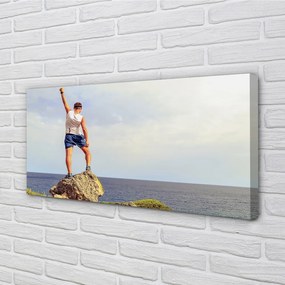 Obraz canvas Muž morská oblohy 140x70 cm