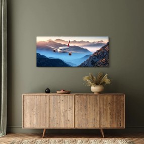 Obraz - Lietadlo nad vrcholmi hôr (120x50 cm)