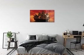 Obraz na skle Loď mora oranžová obloha 140x70 cm