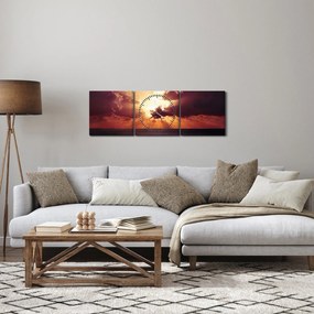 Obraz slnko za mrakmi (s hodinami) (90x30 cm)