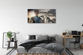 Obraz plexi Cyklista na bicykli mraky 125x50 cm