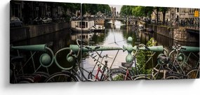 Obraz bicykla v meste (s hodinami) (90x30 cm)