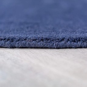 Modrý ručne tkaný vlnený okrúhly koberec ø 150 cm Mia Segment – Flair Rugs