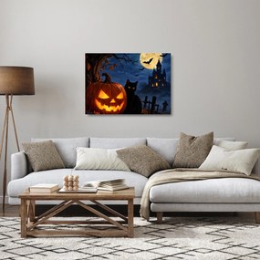 Sklenený obraz - Čierna mačka pri svietiacej tekvici na Halloween (70x50 cm)