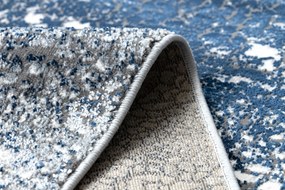 Moderný koberec DE LUXE 528 Abstrakcia - Štrukturálny krém  / tmavomodrý