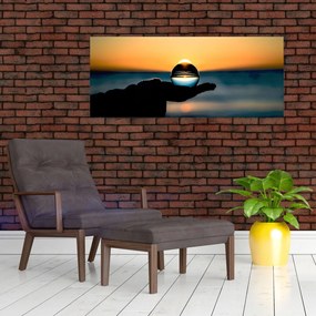 Obraz sklenenej gule v dlani (120x50 cm)