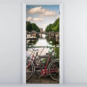 Fototapeta na dvere - Kolesá v meste (95x205cm)