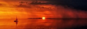 Obraz loďka a nádherný západ slnka