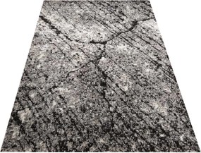 Štýlový hnedý koberec s motívom pripomínajúcom mramor