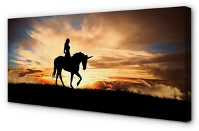 Obraz na plátne Žena na jednorožca západu slnka 100x50 cm