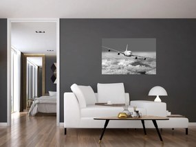 Obraz - Lietadlo v oblakoch, čiernobiele (90x60 cm)