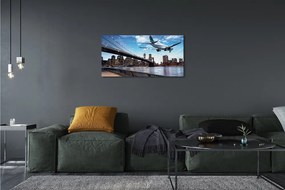 Obraz canvas Lietadiel mraky město 140x70 cm