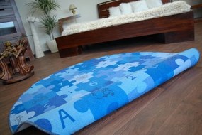 Detský guľatý koberec PUZZLE modrý
