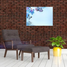 Sklenený obraz - Motýľ na kvetoch orchidey, modrý (70x50 cm)
