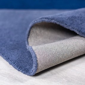 Modrý ručne tkaný vlnený okrúhly koberec ø 150 cm Mia Segment – Flair Rugs