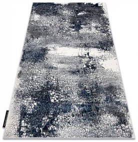 Moderný koberec DE LUXE 528 Abstrakcia - Štrukturálny krém  / tmavomodrý