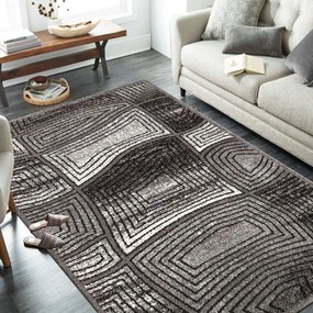 Moderný sivý koberec s abstraktným motívom