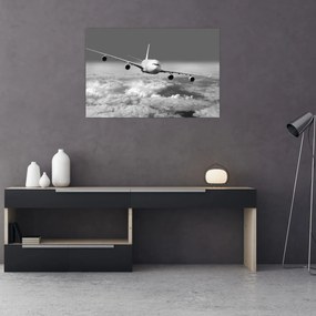Obraz - Lietadlo v oblakoch, čiernobiele (90x60 cm)