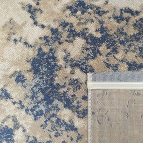 Nádherný moderný koberec v béžovej farbe s modrým detailom