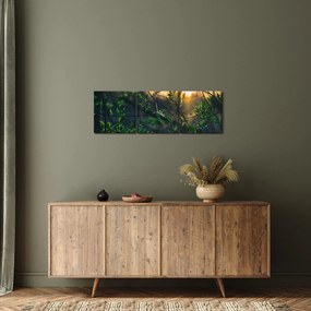 Obraz presvitajúceho slnka cez vetvičky stromov (s hodinami) (90x30 cm)