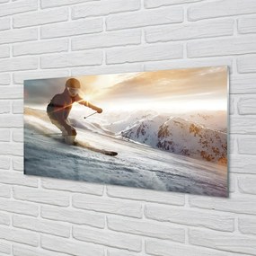Obraz na skle lyžiarske palice muž 100x50 cm