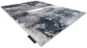 Moderný koberec DE LUXE 528 Abstrakcia - Štrukturálny krém  / tmavomodrý