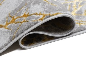 Jednoduchý moderný koberec sivej farby so zlatým motívom Šírka: 80 cm | Dĺžka: 150 cm
