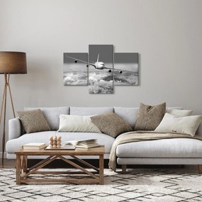 Obraz - Lietadlo v oblakoch, čiernobiele (90x60 cm)