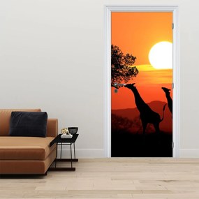 Fototapeta na dvere - Žirafy pri západe slnka (95x205cm)