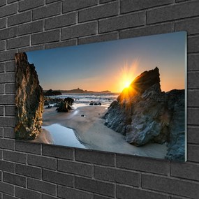 Skleneny obraz Skala pláž slnko krajina 100x50 cm