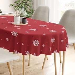 Goldea vianočný oválny obrus 100% bavlnené plátno - snehové vločky na červenej 120 x 160 cm