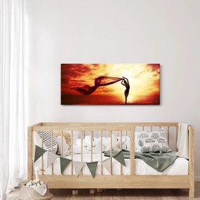 Obraz - Silueta ženy v západu slnka (120x50 cm)