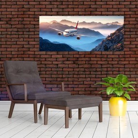 Obraz - Lietadlo nad vrcholmi hôr (120x50 cm)