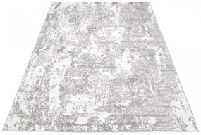 Dizajnový koberec s abstraktným vzorom v krémovej farbe Šírka: 80 cm | Dĺžka: 150 cm