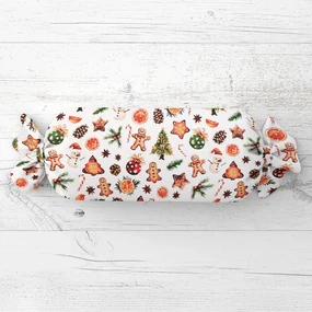 Biante Vianočný vankúš valec bonbon Sandra SA-516 Vianočné perníčky a ozdoby na bielom 15x40 cm