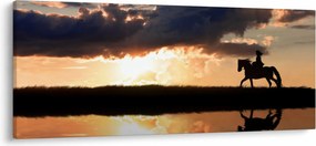 Obraz - Jazdec na koni pri západe slnka (120x50 cm)