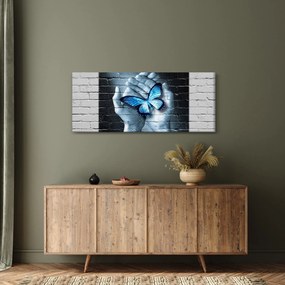 Obraz modrého motýľa na stene (120x50 cm)